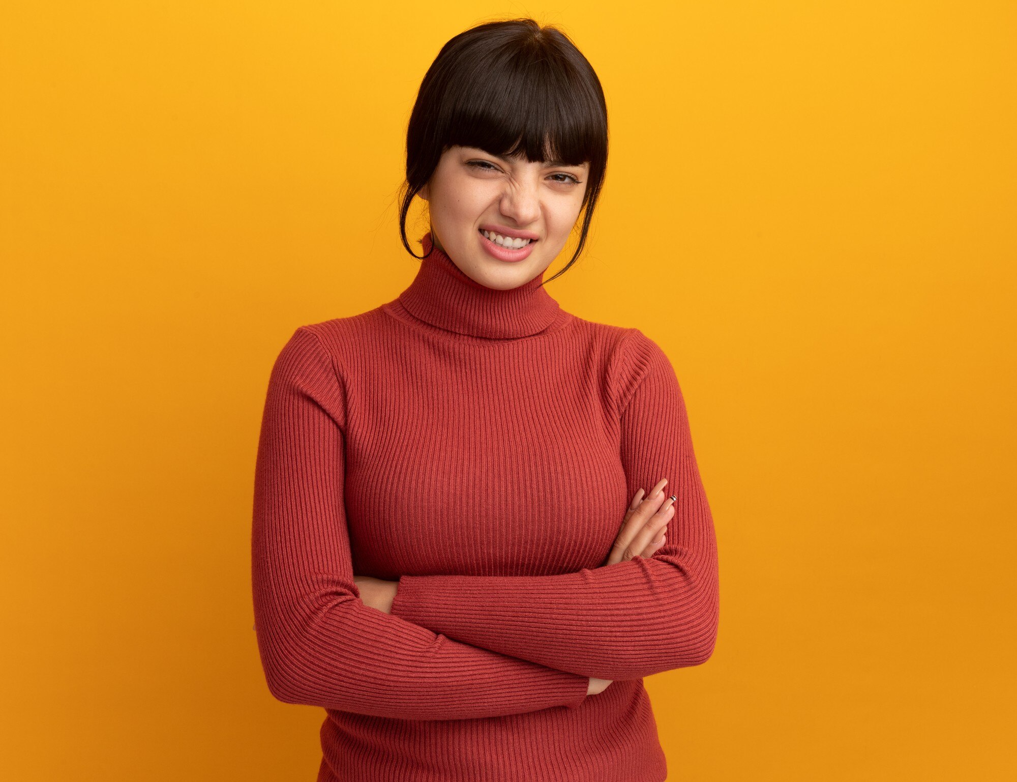 unpleased-young-brunette-caucasian-girl-stands-with-crossed-arms_141793-104161