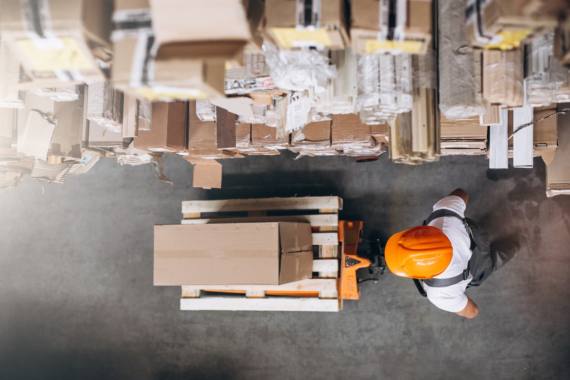 young-man-working-warehouse-with-boxes_1303-16620